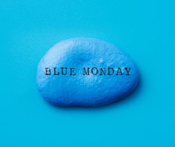 On a blue background, a blue stone bearing the words Blue Monday